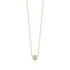 Gold necklace with a small diamond pendant on a white background
