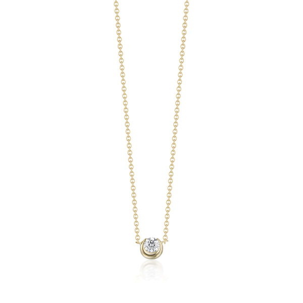 Gold necklace with a small diamond pendant on a white background