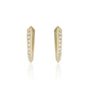 A pair of gold huggie hoop earrings with a row of diamonds pavé-set stones along the front edge, shown on a clean white background with a soft reflection below.