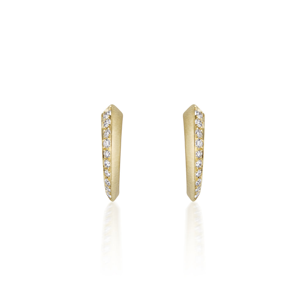Gold hoop earrings with embedded diamonds on a white background