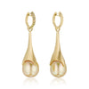 A pair of golden teardrop statement earrings, detachable pearl pendants on hoop earrings with a row of pavé-set ombre yellow diamond stones along the front edge, shown on a clean white background with a soft reflection below.