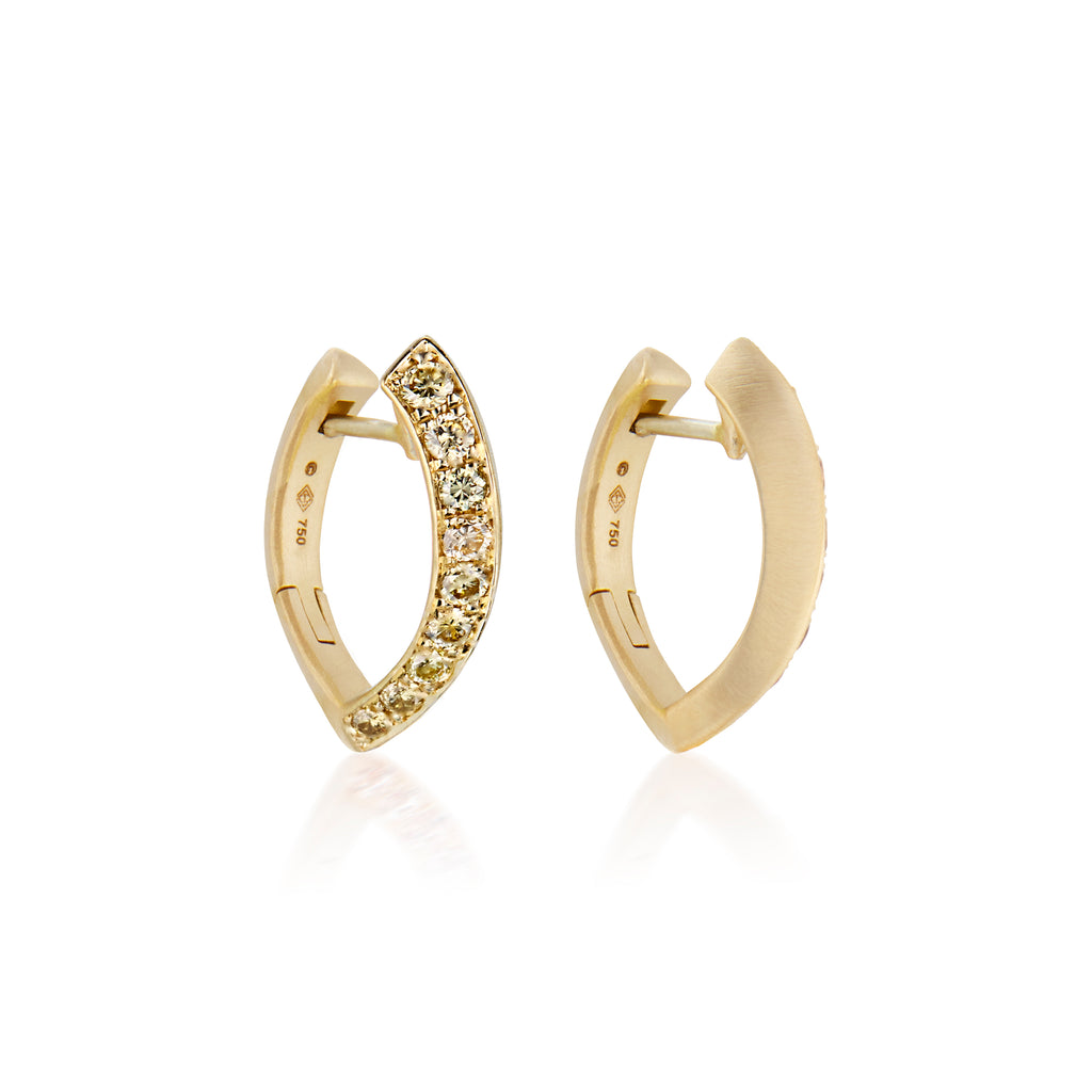 A pair of golden hoop earrings with a row of pavé-set ombre yellow diamond stones along the front edge, shown on a clean white background with a soft reflection below.